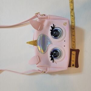 Purse pets pink purse. For 5 yr Olds plus. Comes with batteries and instructions